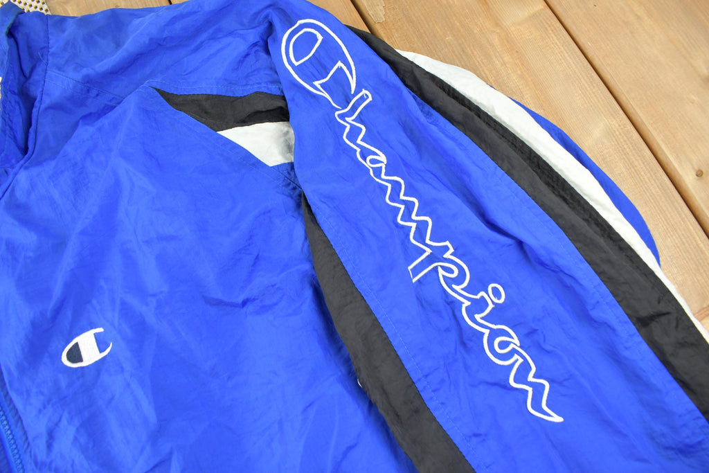 Vintage 1990s Champion Embroidered Spell Out Windbreaker