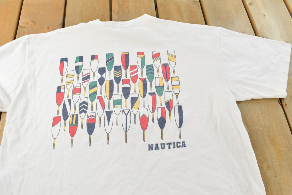 Vintage 1990s Nautica Rowing Oars Graphic T Shirt Men's L / Big Box Logo Print / 90s / Streetwear / Preppy / Made In USA / Single Stitch
