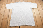 Vintage 1990s Castaways West Seneca Striped Mock Neck Graphic T Shirt