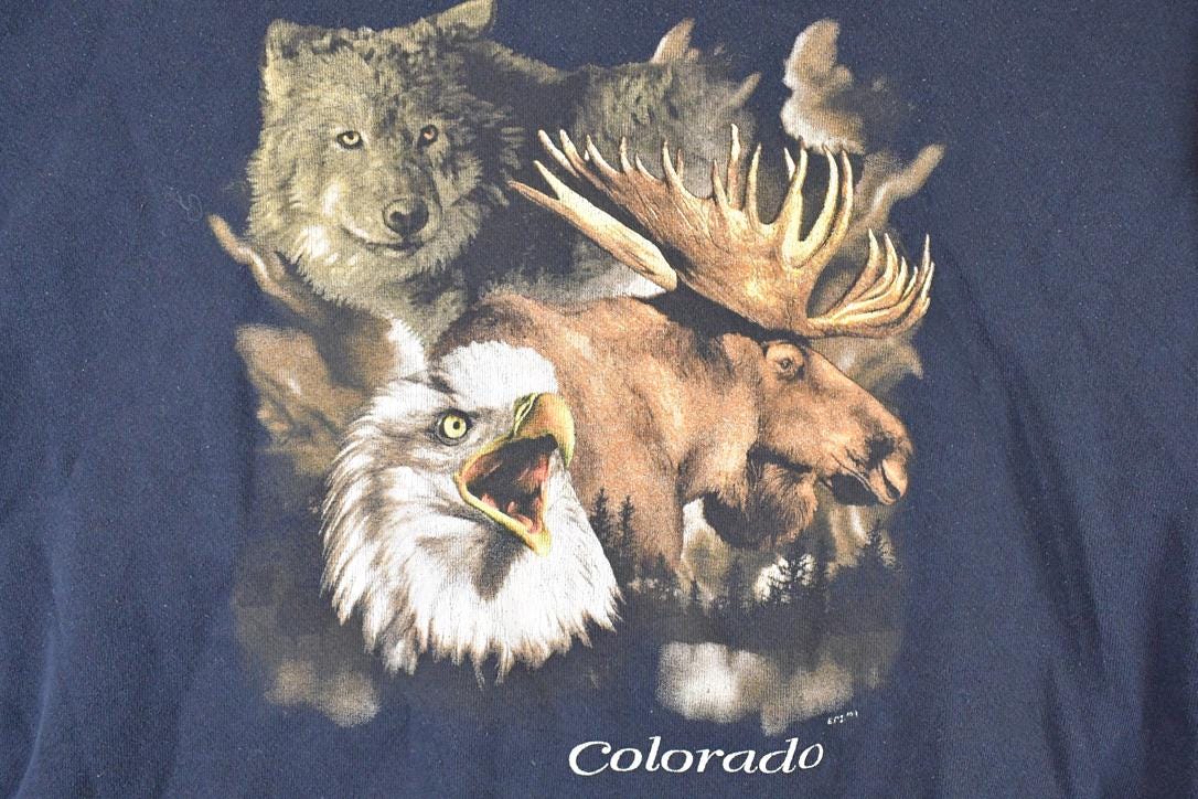 Vintage 1990s Colorado Hawk Wolf Moose Cartoon Graphic Print Crewneck Sweatshirt Mens L