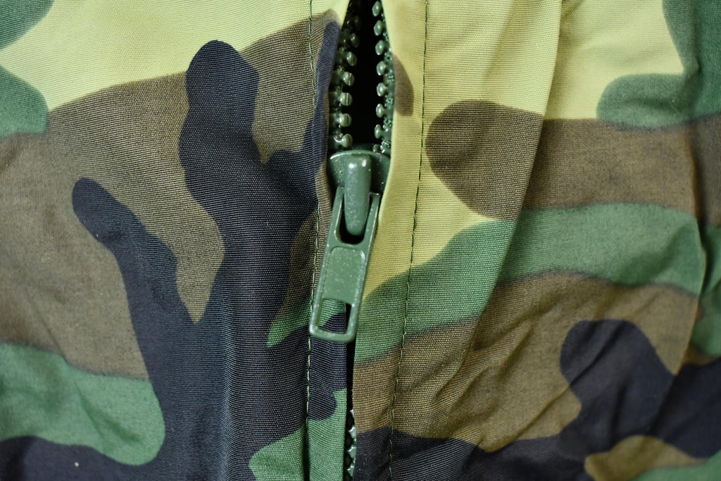 Vintage 1990s Camo Raiders NFL Football Hooded Puffer Jacket