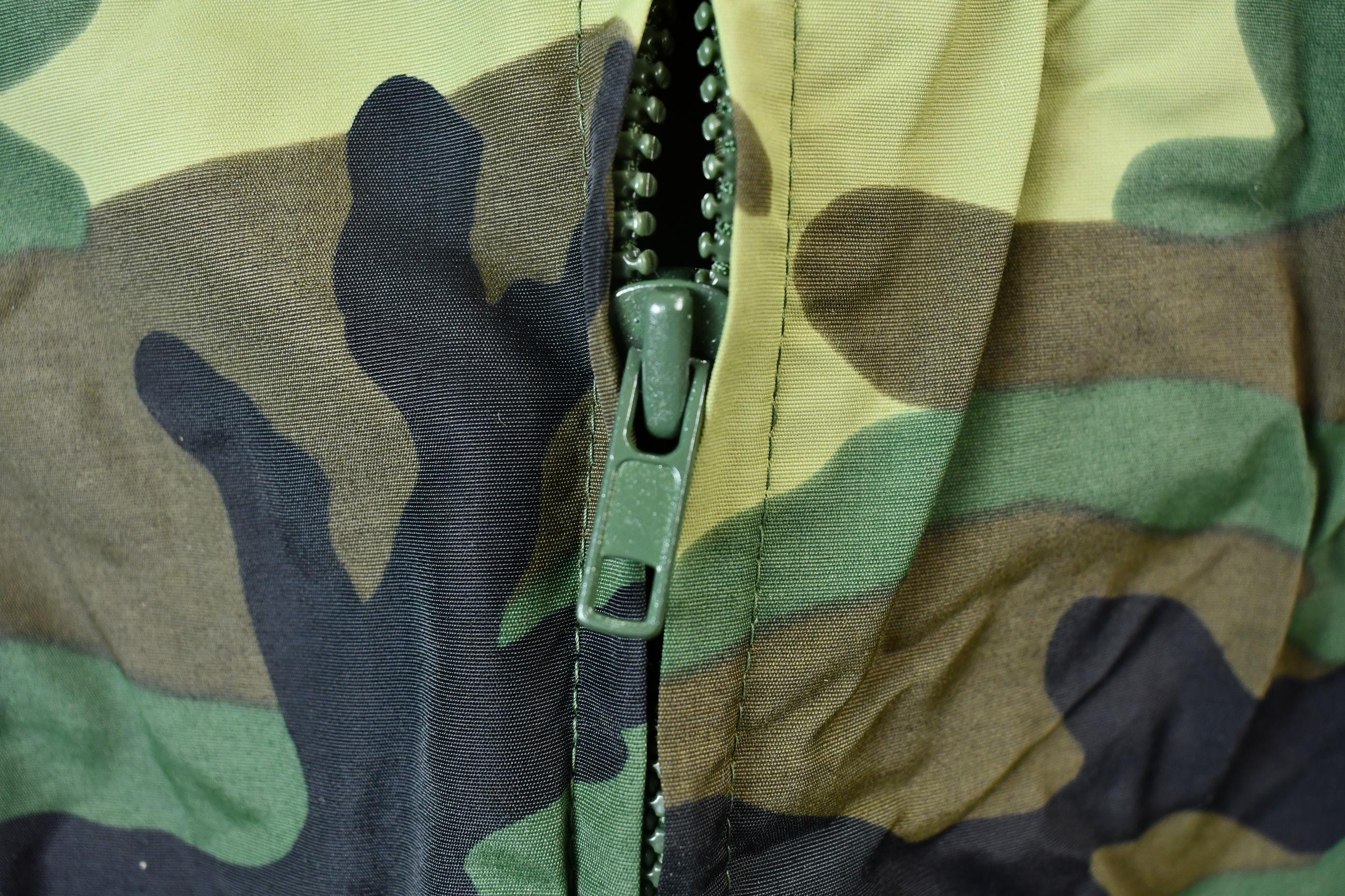 Vintage 1990s Camo Raiders NFL Football Hooded Puffer Jacket