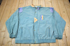 Vintage 1990s Puma Embroidered Sun Faded Windbreaker Jacket Size XL