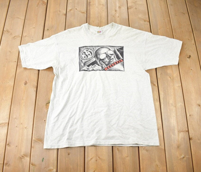 Vintage 1997 Helvetia Bold Art Deco Air Mail Stamp Graphic T Shirt Made In USA