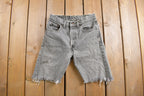 Vintage 1980s Levi's 505 Grey Light Wash Cut Offs