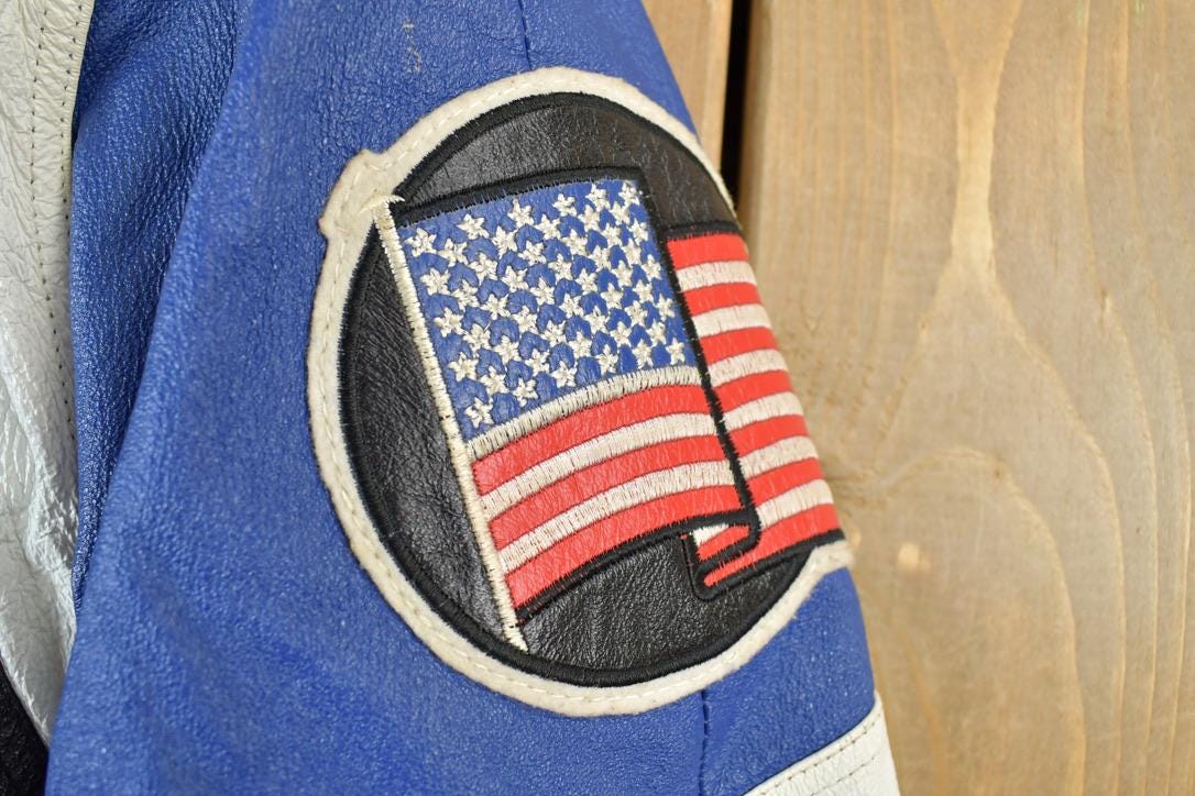 Vintage 1990s Michael Hoban American Flag Leather Patch AOP Jacket Made In USA