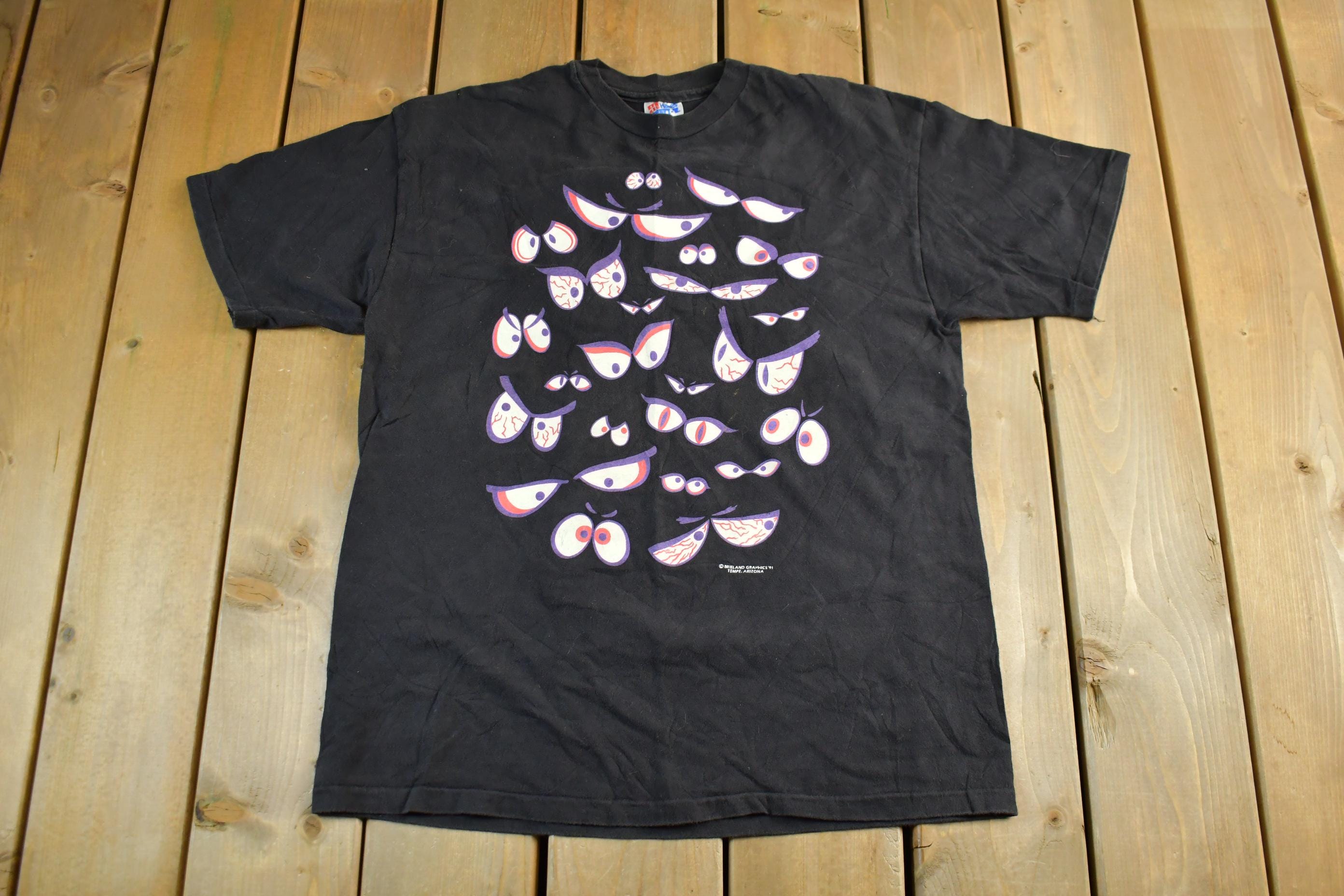 Vintage 1990s Brieland Graphics Glow In The Dark Eyes T-Shirt Men's Large