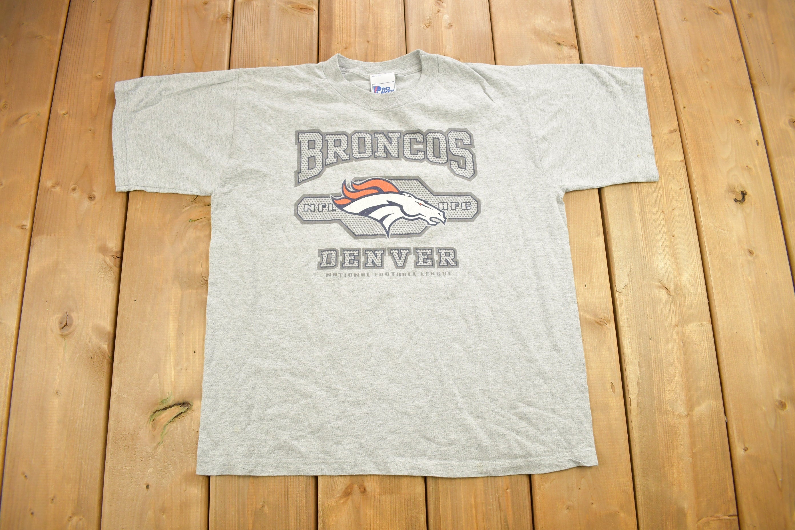 Vintage 1990s Denver Broncos NFL Pro Player Kids Size Graphic T-Shirt