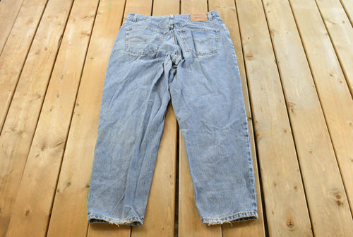 Vintage 1990s Levi's 560 Loose Fit Denim Blue Jeans Size 35 x 30 / 90s Levi's / Distressed Sun Faded Jeans / Streetwear