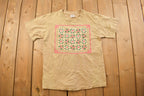Vintage 1990s Cute Family Quilt Themed Graphic T Shirt