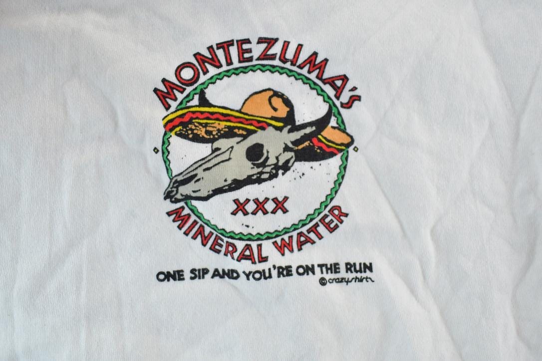 Vintage 1980s Crazy Shirts Montezumas Mineral Water Souvenir Single Stitch Graphic Print T-Shirt