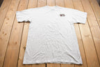 Vintage 1990s Castaways West Seneca Striped Mock Neck Graphic T Shirt