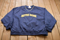 Vintage 1990s Champion Notre Dame Graphic Windbreaker Jacket