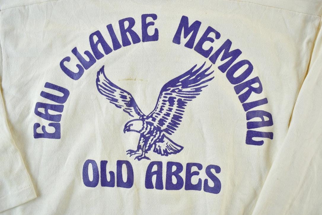 Vintage 1960s Russell Athletic Eau Claire Memorial Old Abes Gerke 83 University Collegiate T-Shirt  NCAA Tee  Americana  Sportswear