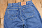 Vintage 1990s Levi's 560 Medium Wash Loose Fit Tapered Leg Mom Jeans