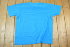 Vintage 1990s Blank Sky Blue Souvenir Single Stitch Graphic Print T-Shirt /