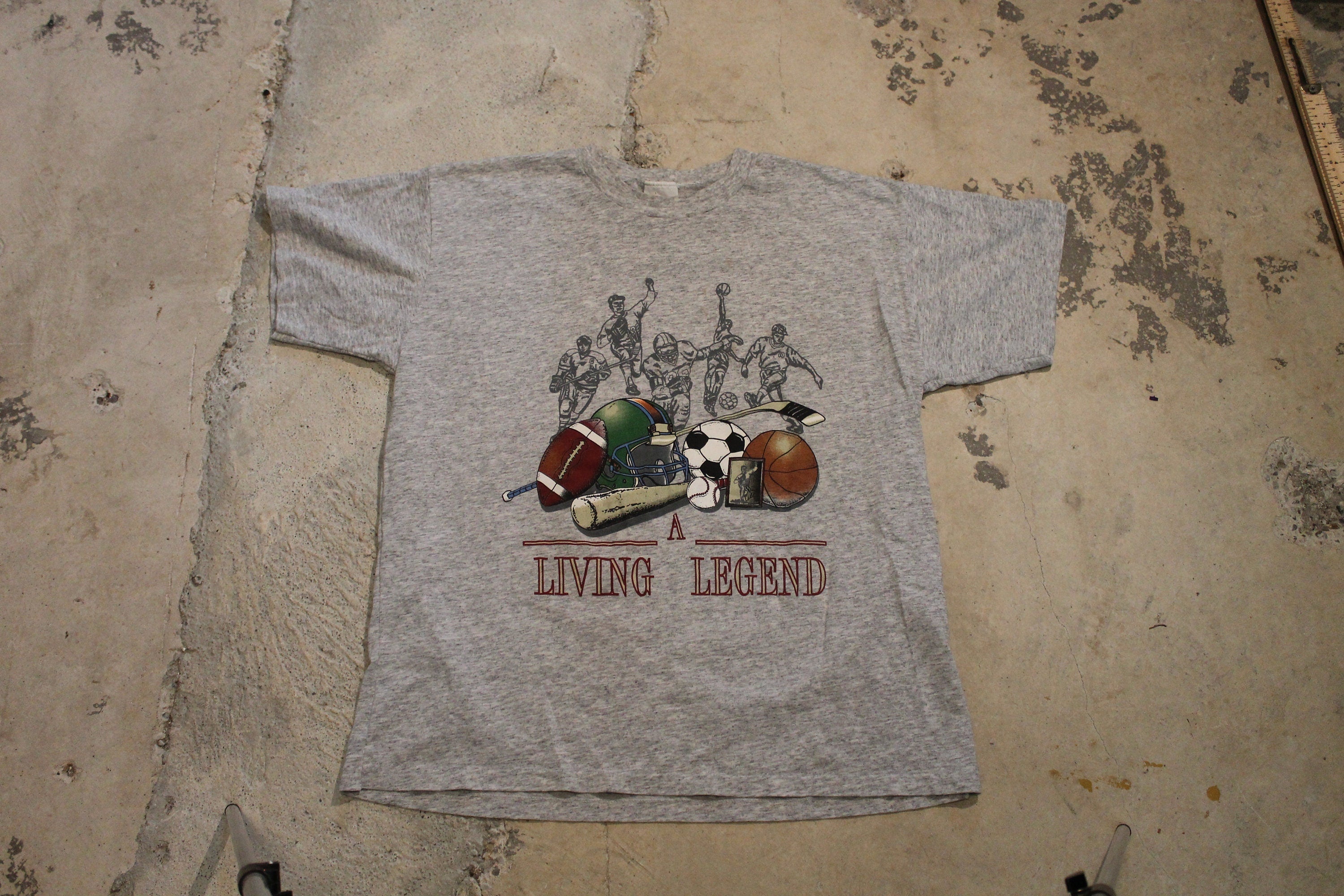 Vintage 1990s T-Shirt A Living Legend Sportswear Graphic T Shirt  80s  90s  Streetwear Fashion  American Football  Avon