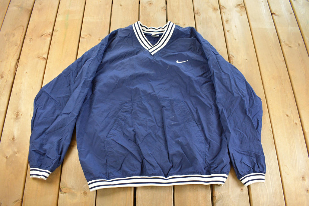 Vintage 1990s Nike Embroidered Mini Swoosh Pullover Windbreaker Men's XL
