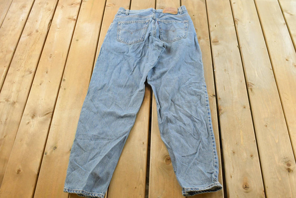 Vintage 1990s Levi's 560 Loose Fit Denim Blue Jeans Size 30 x 32 / 90s Levi's / Distressed Sun Faded Jeans / Made in USA / Streetwear