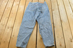 Vintage 1990s Levi's 560 Loose Fit Denim Blue Jeans Size 30 x 32 / 90s Levi's / Distressed Sun Faded Jeans / Made in USA / Streetwear