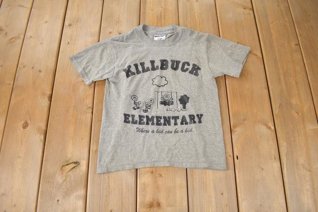 Vintage 1990s KillBuck Elementary Where A Kid Can Be A Kid Single Stitch Graphic Baby T Shirt Made In USA