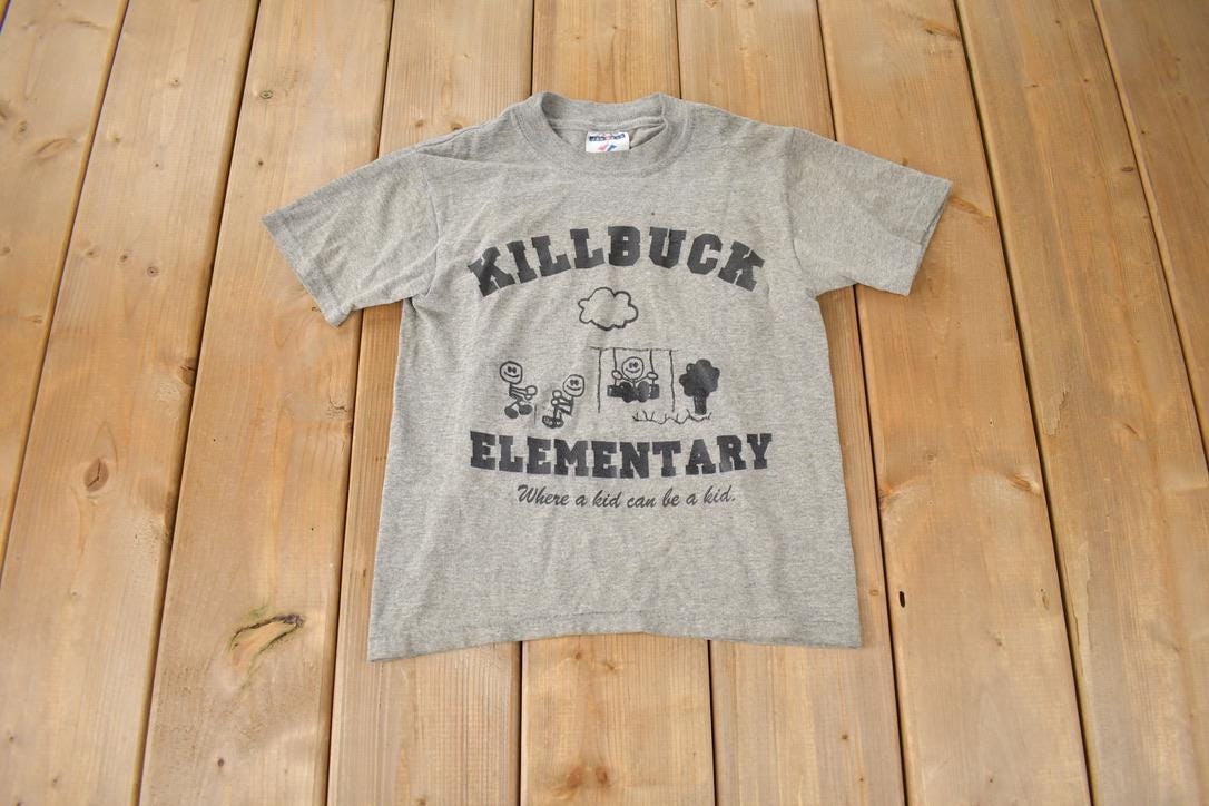 Vintage 1990s KillBuck Elementary Where A Kid Can Be A Kid Single Stitch Graphic Baby T Shirt Made In USA