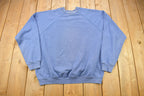Vintage 1980s Tultex Sun Faded Blue Blank Raglan Crewneck Sweatshirt