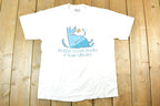 Vintage 1990s Wolfin Down Books At Your Library Souvenir T-Shirt Mens L