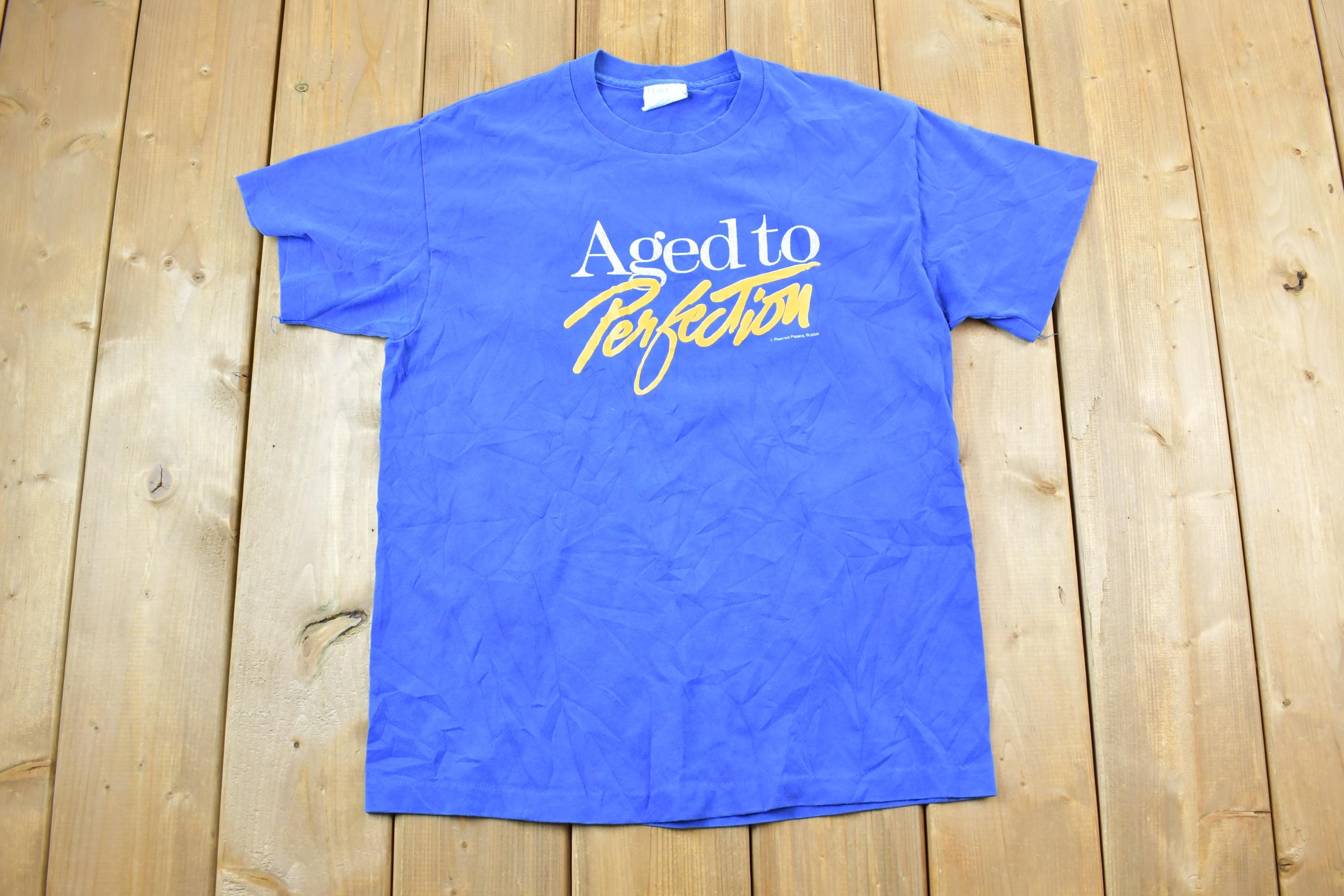 Vintage 1990s Aged To Perfection Peacock Papers Boston Graphic T-Shirt