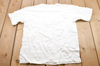 Vintage 1990s Nassau Paradise Graphic Embroidered T-Shirt