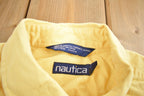 Vintage 1990s Nautica Embroidered Yellow Button Up Shirt
