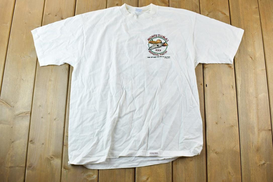 Vintage 1980s Crazy Shirts Montezumas Mineral Water Souvenir Single Stitch Graphic Print T-Shirt