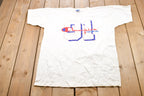 Vintage 1990s Champion Footwear Graphic T-Shirt