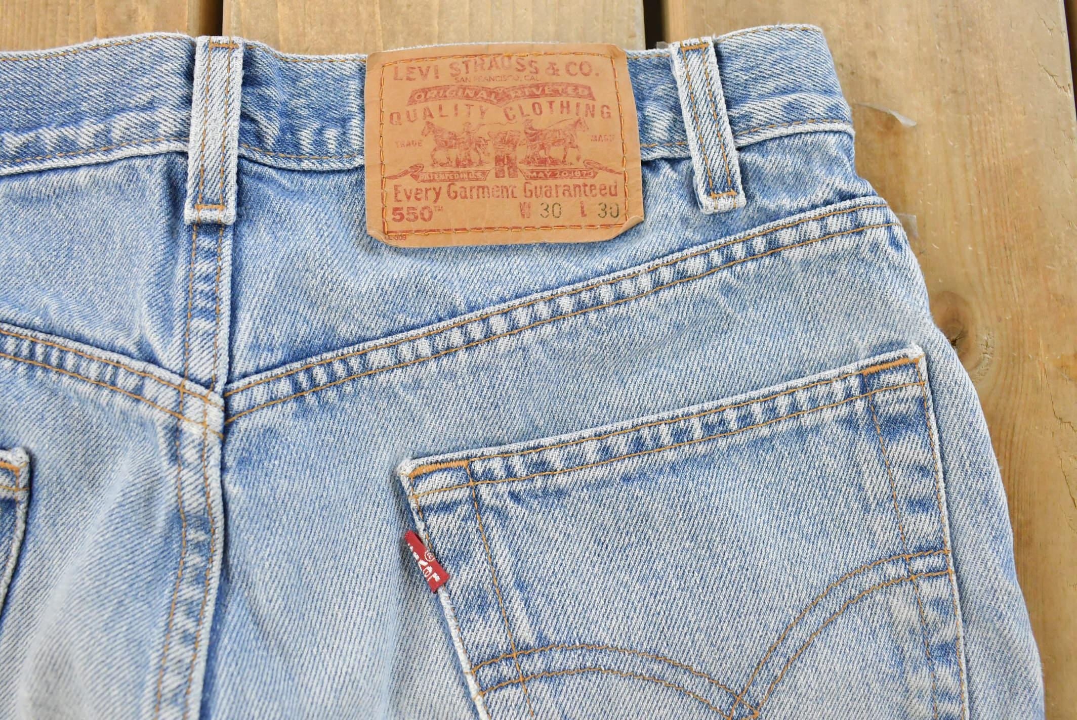 Vintage 1990s Levi's 550 Relaxed Fit Distressed Denim Jeans Men's 28 x 29 / 90s Levi's / Streetwear