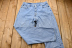 Vintage 1990s Levi's 560 Light Wash Loose Fit Tapered Leg Mom Jeans