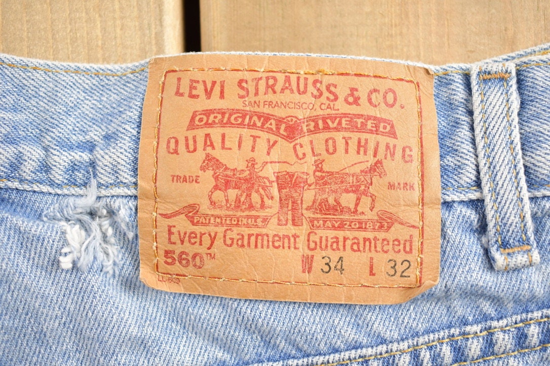 Vintage 1990s Levi 560 Red Tab Jeans Size 35 x 28