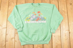 Vintage 1990s Quebec Floral Graphic Print Crewneck Sweatshirt Women's L