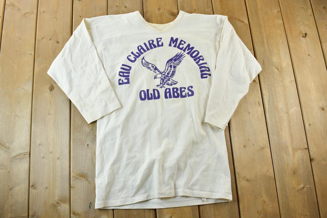 Vintage 1960s Russell Athletic Eau Claire Memorial Old Abes Gerke 83 University Collegiate T-Shirt  NCAA Tee  Americana  Sportswear