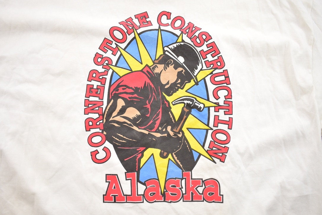 Vintage 1990s Hanes Power Building Cornerstone Construction Alaska Buff Worker Graphic T-Shirt