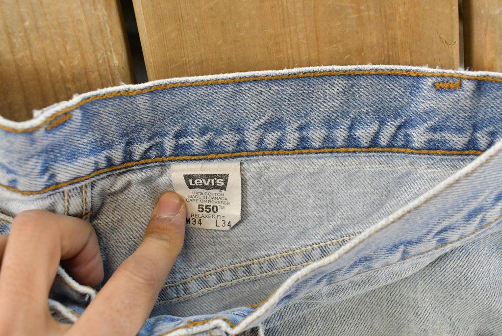 Vintage 1990s Levi's Distressed 550 Relaxed Fit Denim Jeans Men's 33 x 33 / 90s Levi's / Blown Out Sun Faded Jeans
