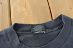 Vintage 1990s FEARLESS All Over Print Skull Graphic T-Shirt