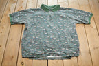 Vintage 1990s Warner Brothers Tasmanian Devil Tools Quarter Button Up Golf Shirt