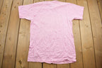Vintage 1990s Queens Are Wild Single Stitch Pink Graphic T-Shirt Made In USA