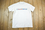 Vintage 1990s Worldweave Graphic T-Shirt