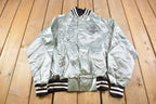 Vintage 1980s John D. Roba And Associates The Spirt Of Success Satin Bomber Snap Button Silver Jacket
