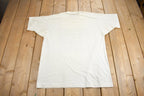Vintage 1990s La Face Du Monde Évolue Technilab Graphic T Shirt