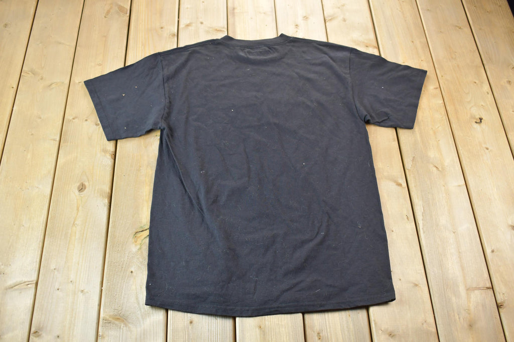 Vintage 1990s Single Stitch Only The Strong Survive Tultex T-Shirt Joke
