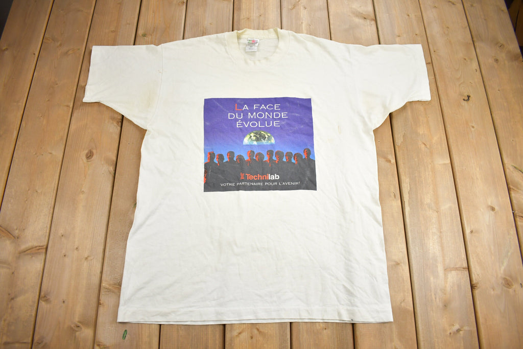 Vintage 1990s La Face Du Monde Évolue Technilab Graphic T Shirt