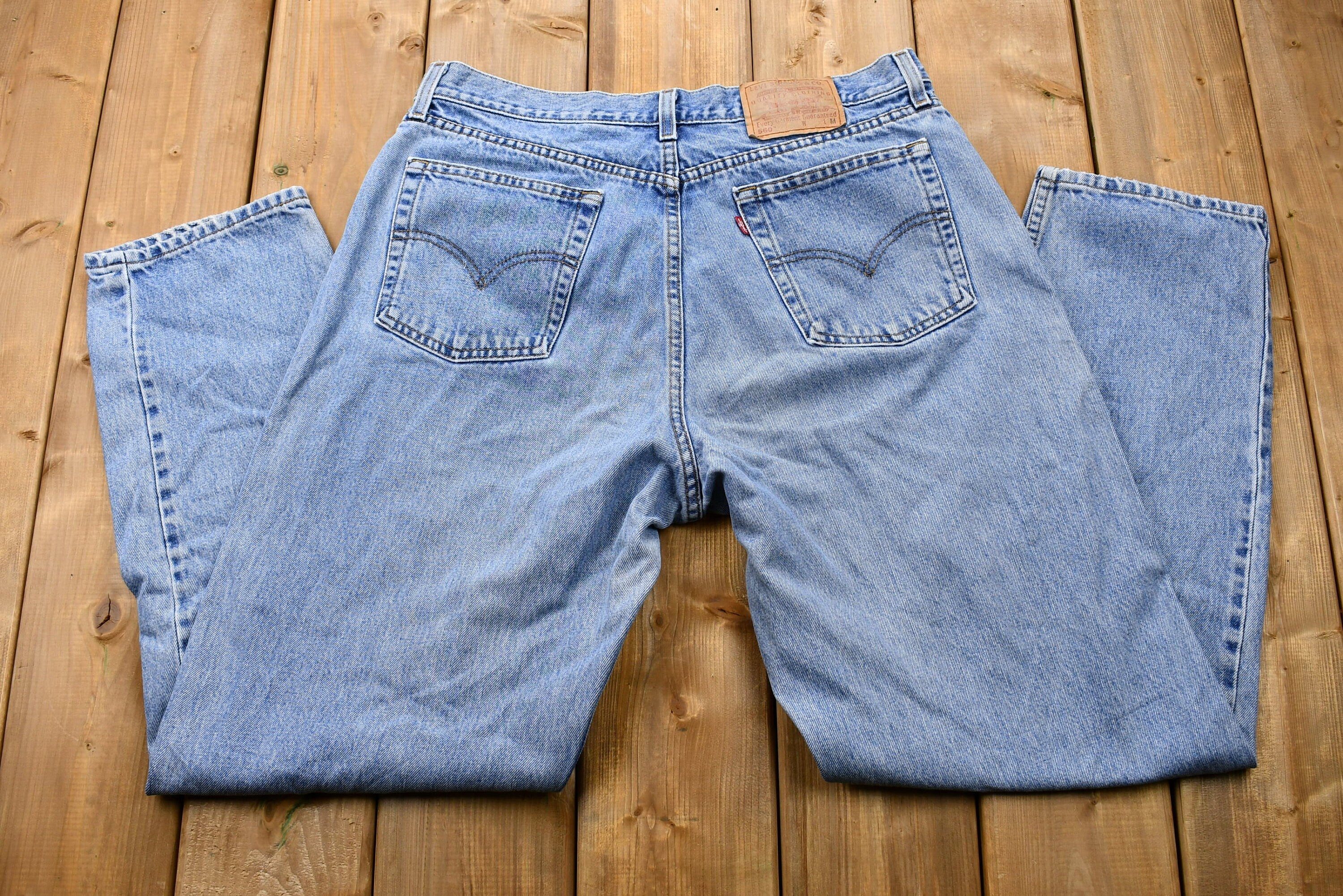 Vintage 1990s Levi's 560 Light Wash Loose Fit Tapered Leg Mom Jeans