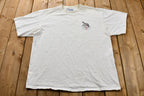 Vintage 1990s Distressed Crazy Frosty The Snowman Snowboarding T-Shirt